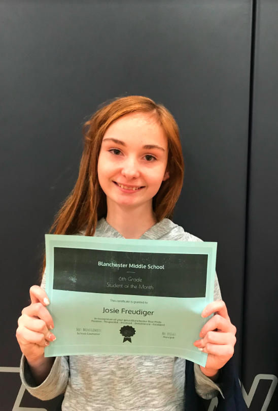 Josie Freudiger holding certificate