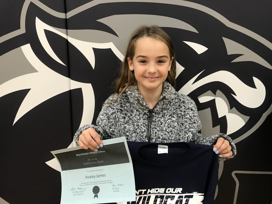 Kealey James holding certificate and shirt