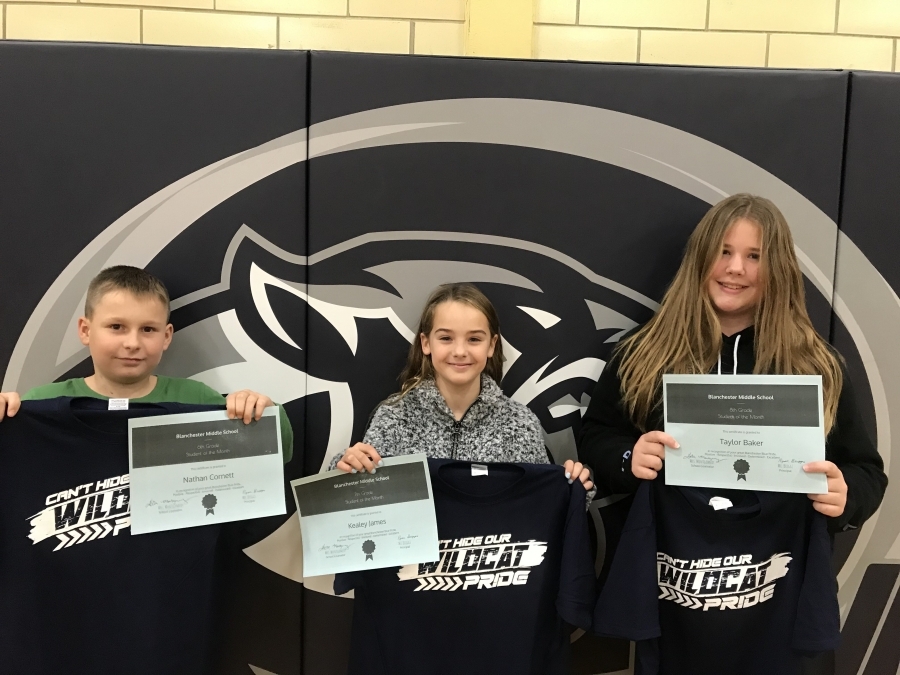 Nathan, Kealey and Taylor holding shirts & certificates